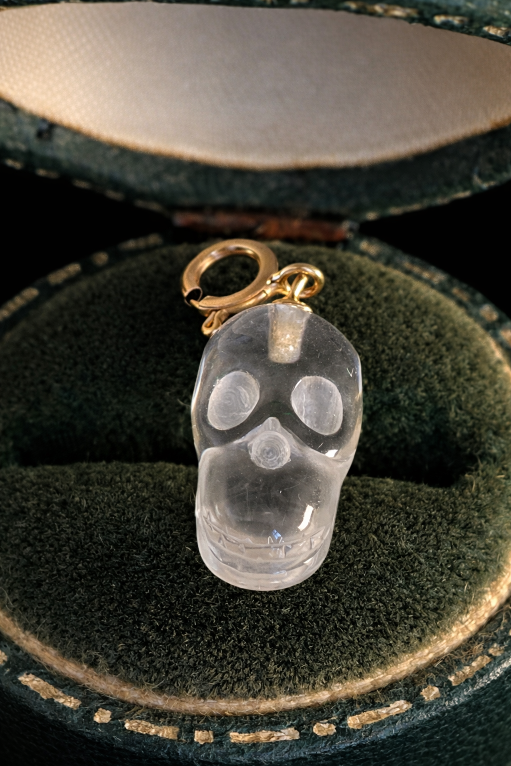 Rock crystal skull charm